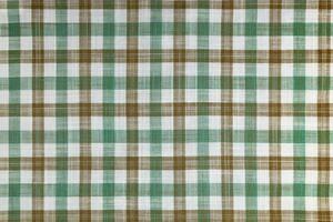 Green and brown checkered texture fabric, tartan pattern background. photo