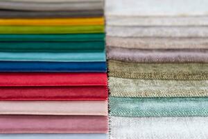 Multi colored set of upholstery fabric samples for selection, collection of textile swatches photo