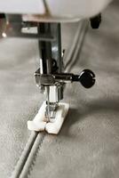 sewing machine presser foot and item of clothing photo