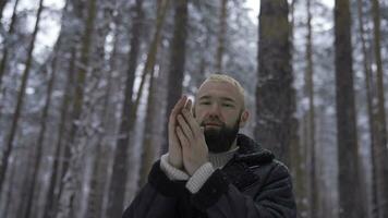 Man in a cold snowy forest photo