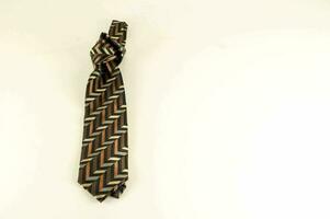 a brown and black tie with a chevron pattern photo