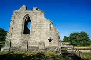 the ruins of an old stone building photo