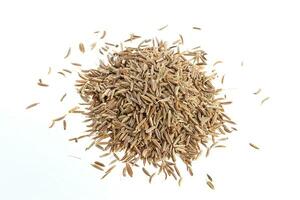 Pile of Cumin seeds isolated on white background photo