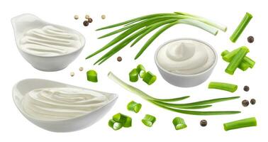 Sour cream and chives isolated on white background, green onion with sour cream sauce photo