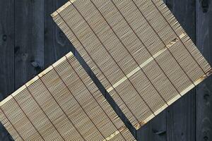 Wood bamboo mat on table, top view photo