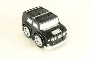 a toy SUV on a white background photo