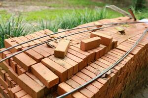 Pallet a red brick building material stack of new red bricks for construction. photo