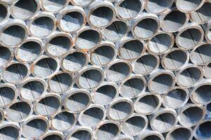 a close up of a stack of metal pipes photo