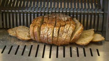 Sliced white bread in a cutting machine. video