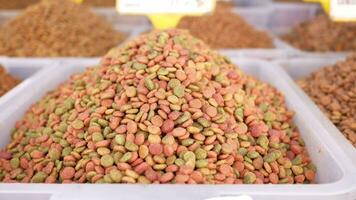 stack of dried cat food display for sale at local market video