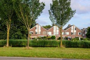 a row of houses on the side of a road photo