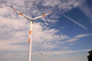 wind turbines against a blue sky photo