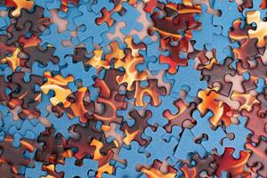 Top View of Mixed Pieces of a Jigsaw Puzzle - Texture Background photo