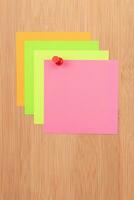 Colored Sticky Notes with Copyspace Pinned to the Wooden Message Board. To Do List Reminder in Office. Blank Memo Sticker at Work Template. Empty Checklist Mockup photo