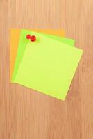 Colored Sticky Notes with Copyspace Pinned to the Wooden Message Board. To Do List Reminder in Office. Blank Memo Sticker at Work Template. Empty Checklist Mockup photo