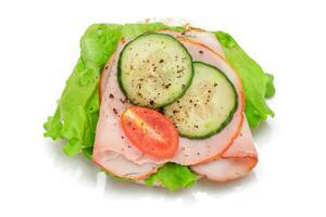 Light Breakfast. Quick and Healthy Sandwich. Rice Cake with Ham, Tomato, Fresh Cucumber and Green Salad Isolated on White photo