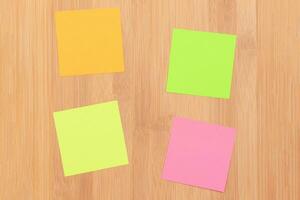 Colored Sticky Notes with Copyspace Pinned to the Wooden Message Board. To Do List Reminder in Office. Blank Memo Sticker at Work Template. Empty Checklist Mockup photo