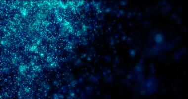 Blurred blue abstract background of bokeh and small round particles of energy magical holiday flying dots on a black background photo