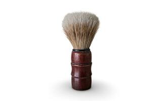 Hair and beard shaving brush with wooden handle isolated white background photo