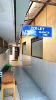 hanging men's and women's toilet notice boards photo