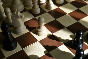 Beautiful chess pieces on the board. The chessboard. Chess competitions. photo