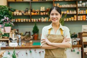 Portrait of Asian woman working in a plant shop photo