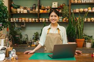 Portrait of Asian woman working in a plant shop photo