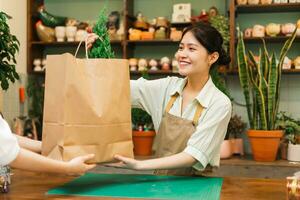 Portrait of Asian woman working in a plant shop photo