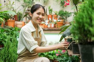 Portrait of Asian woman working in a plant shop photo