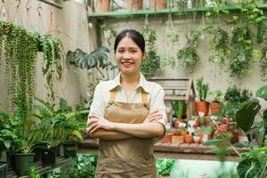 Portrait of Asian woman working in a plant shop photo