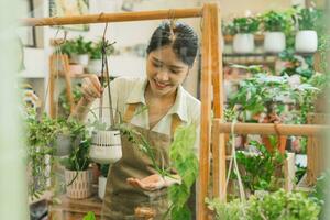 Portrait of Asian woman working in a plant shop photo