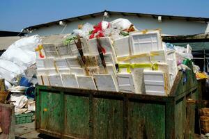 Pile of Garbage in Big Container at Fresh Market. photo