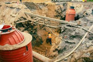 Installation of Underground Urban Sewerage and Water Supply System with Buried Plastic Tanks photo