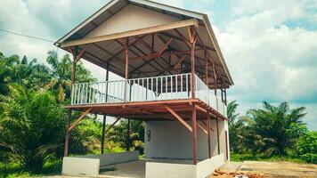 This farmer's hall presents a two-story concept that is functional and environmentally friendly. The first floor is the center of agricultural activities photo