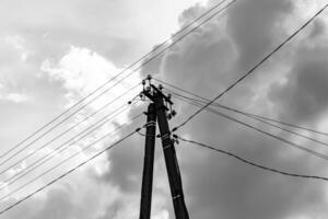 Power electric pole with line wire on light background close up photo