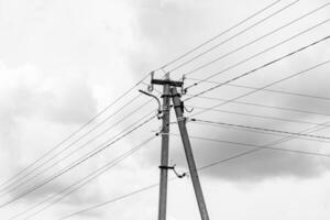 Power electric pole with line wire on light background close up photo