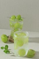 Grape Mojito with Fresh Mint on Rustic Background photo