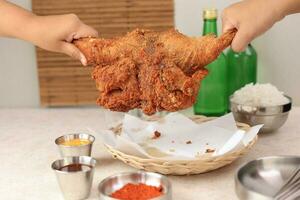 Korean Fried Whole Chicken or Style Market Deep Fried Sijang Tongdak photo