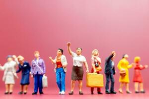 A group of women stand together On a pink backdrop, International Women's Day concept photo