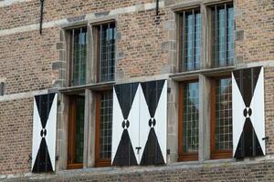 medieval brick wall with windows photo