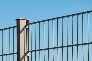 Metal fence barrier football field photo