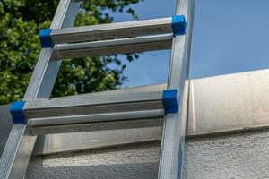 aluminum ladder applied to wall photo