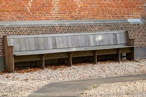 big bench at a wall photo