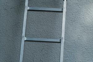 aluminum ladder applied to wall photo