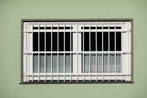 window with metal grille photo