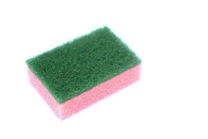 Soft cleaning sponge for washing dishes, isolated in white background. Concept, useful equipment for cleaning, scrubbing dish in kitchen or use for other purposes. Household tool. photo