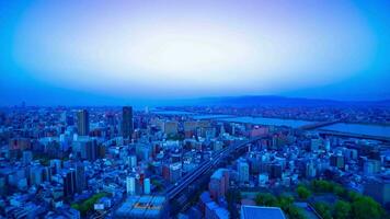 A dawn timelapse of panoramic cityscape near Yodo river in Osaka zoom video