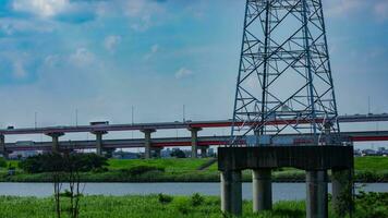 A timelapse of traffic jam at the downtown street and highway telephoto shot tilt video