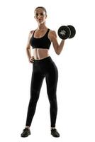 Brunette woman in black leggings, top and sneakers is posing isolated on white. Fitness, gym, healthy lifestyle concept. Full length. photo
