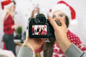 Digital single-lens reflex camera in hands. Man photographer makes photos. Male hands hold the camera close-up photo